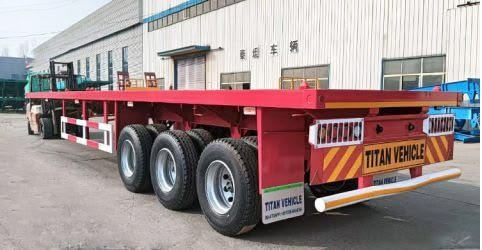 Flatbed trailer carrying steel and building material